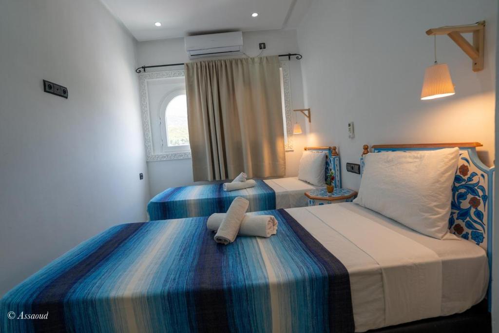 Postel nebo postele na pokoji v ubytování Hotel Miramonte