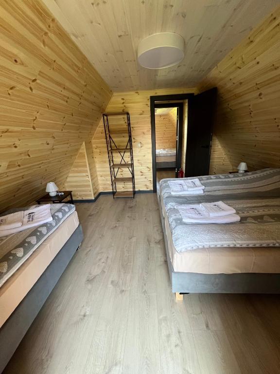 Postel nebo postele na pokoji v ubytování Sudecki Domek