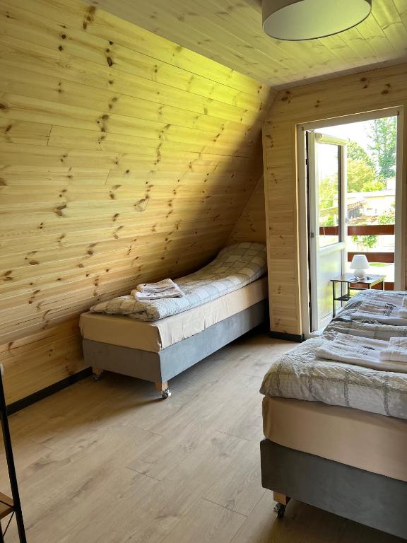 Postel nebo postele na pokoji v ubytování Sudecki Domek