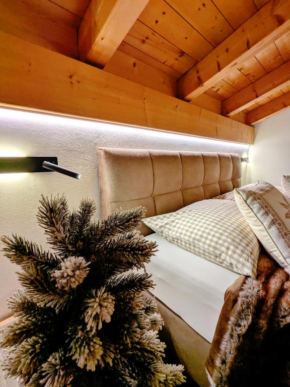 Postel nebo postele na pokoji v ubytování Garni Hotel Belalp