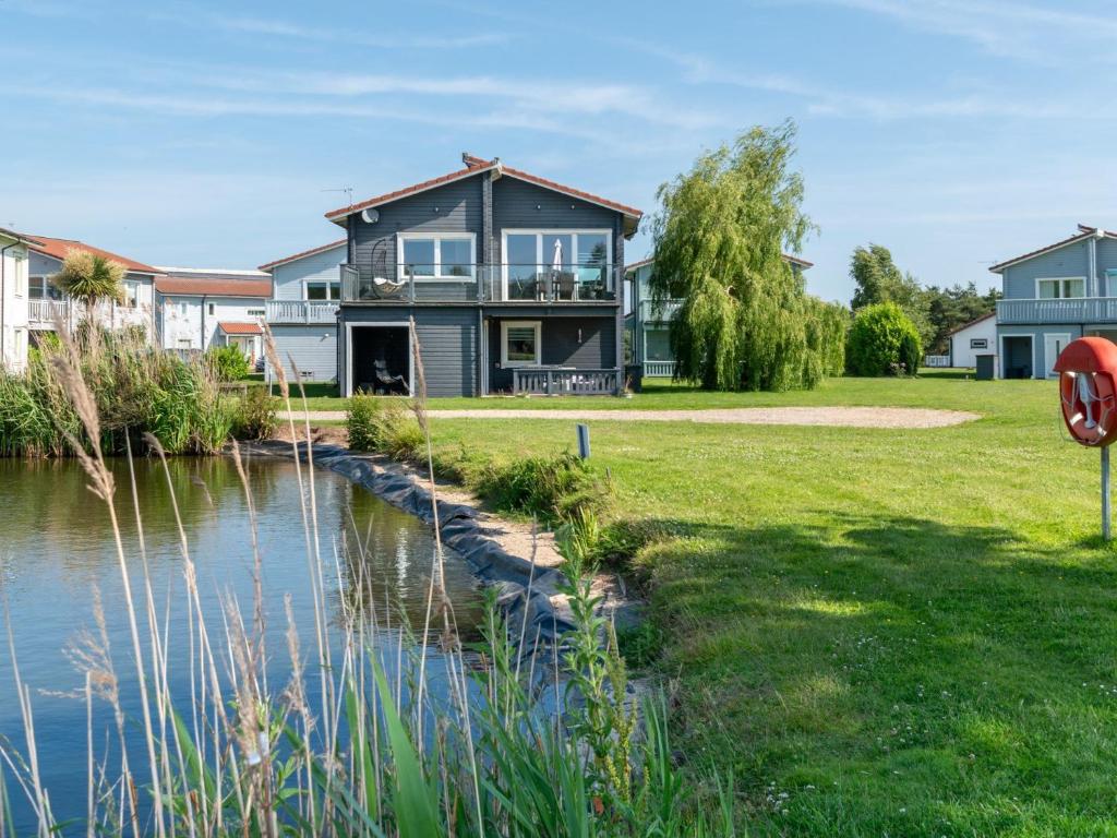 a house with a river in front of it at 3 Bed in Hopton 88649 in Fritton Norfolk