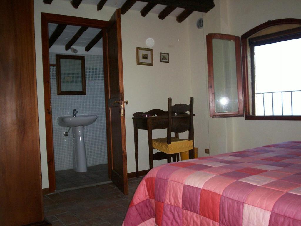 Posteľ alebo postele v izbe v ubytovaní Podere Il Caggio Rooms