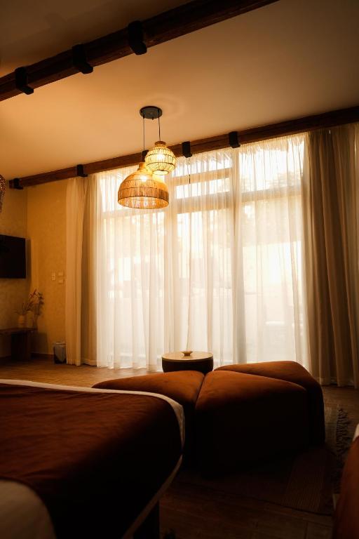 Postel nebo postele na pokoji v ubytování Sphinx House