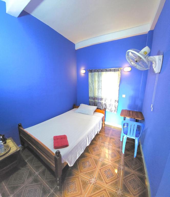 Postel nebo postele na pokoji v ubytování Khmer House Guesthouse