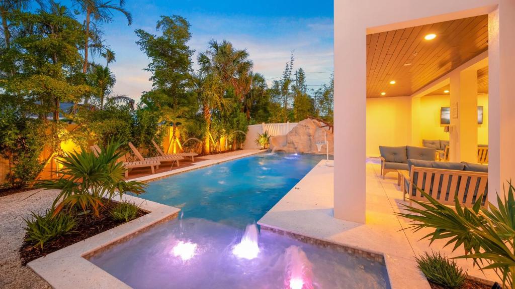 a swimming pool with lights in a house at Sunset Sky in Clearwater Beach