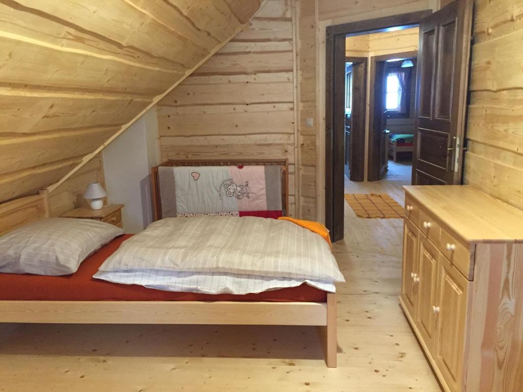 Postel nebo postele na pokoji v ubytování Drevenica u Michala