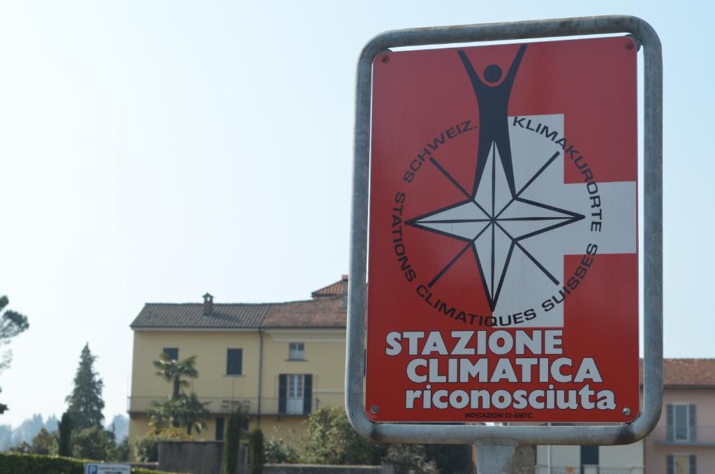 a sign for a building with a star on it at Albergo della Posta in Astano