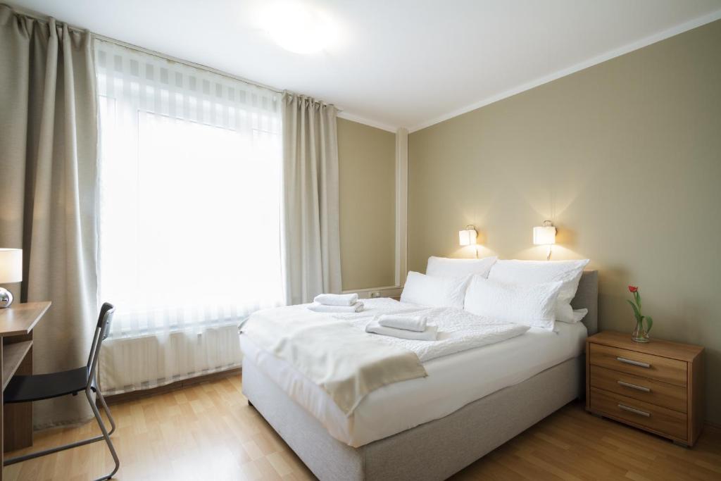 Postel nebo postele na pokoji v ubytování Hotel Pankow