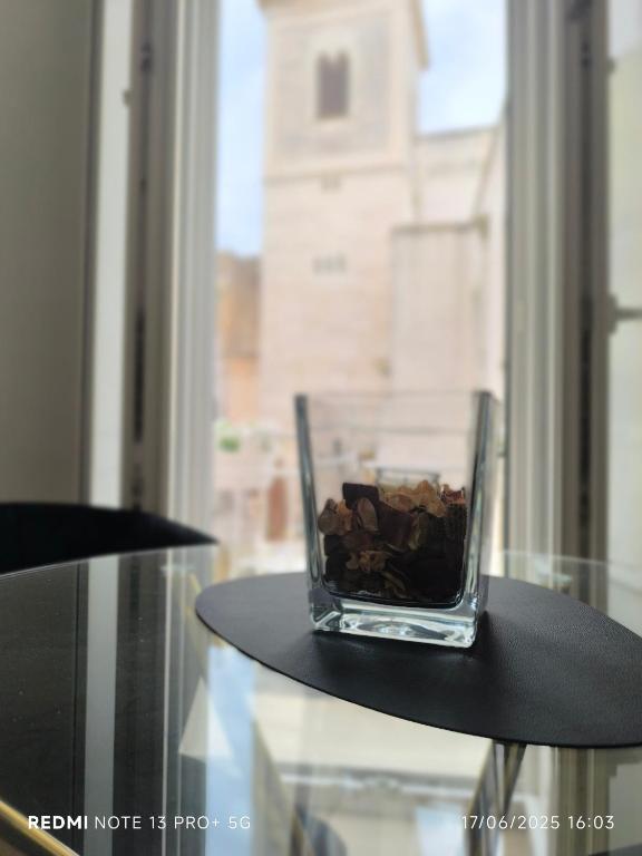 a glass vase sitting on top of a table at Sott'o Cambanil in Gioia del Colle