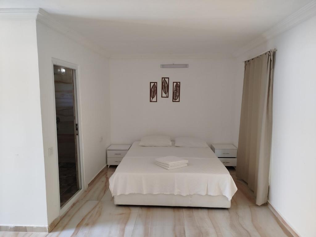 Postel nebo postele na pokoji v ubytování Kiriş Garden Hotel