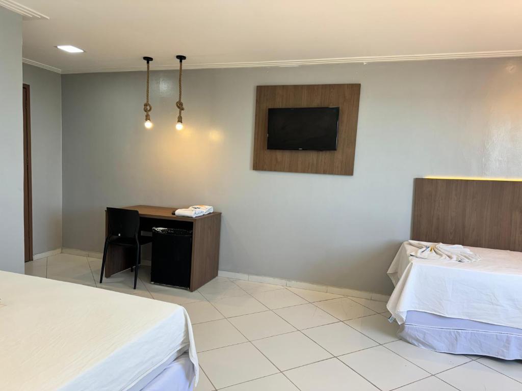 Postel nebo postele na pokoji v ubytování Hotel Luar de Itapua