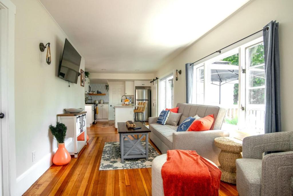 a living room with a couch and a table at Lakeview Getaway with Hot Tub in Billerica