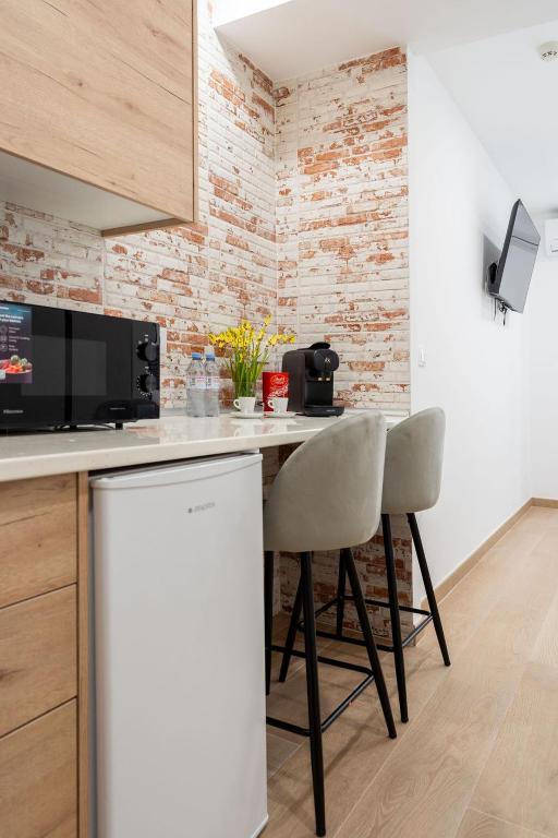 Kuchyň nebo kuchyňský kout v ubytování Emily Suites