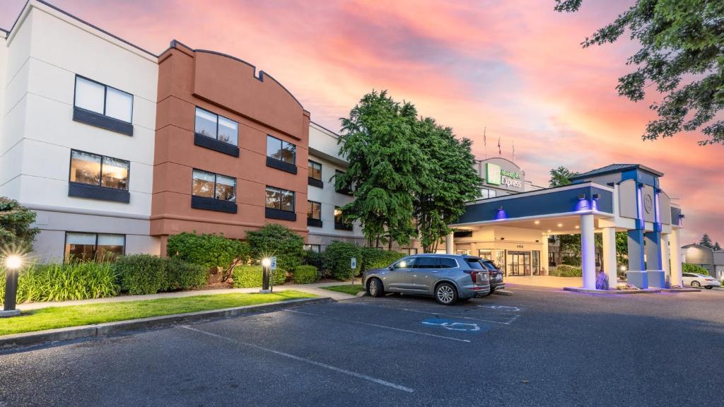 a car parked in a parking lot in front of a building at Holiday Inn Express Bellingham by IHG in Bellingham