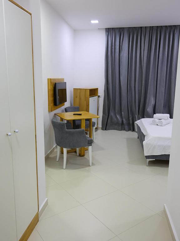 Postel nebo postele na pokoji v ubytování Hotel Adria