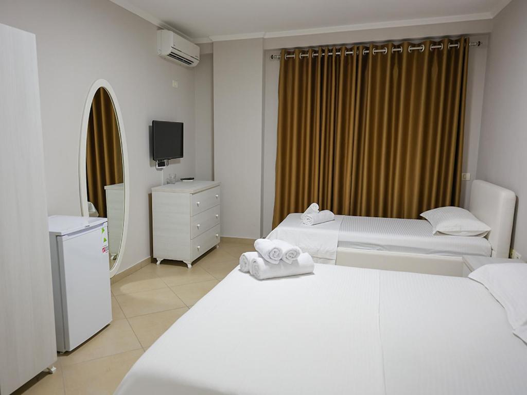 Postel nebo postele na pokoji v ubytování Hotel Adria