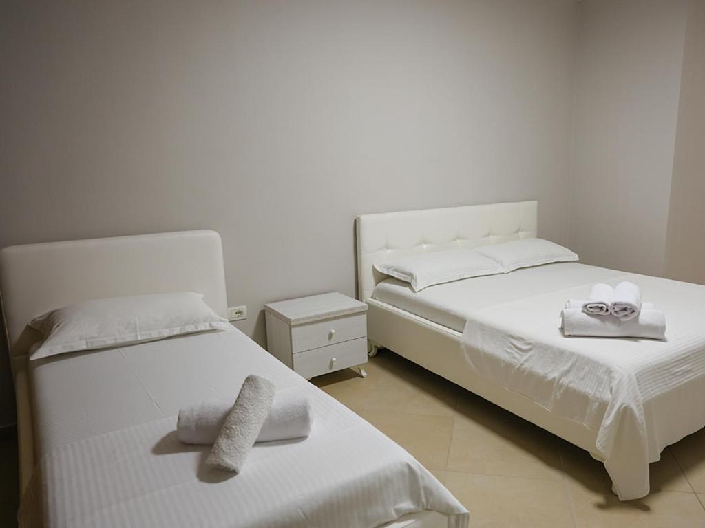 Postel nebo postele na pokoji v ubytování Hotel Adria
