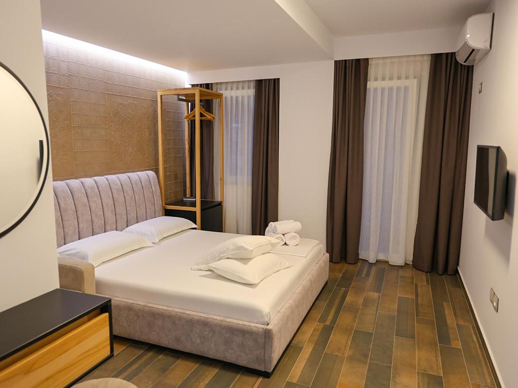 Postel nebo postele na pokoji v ubytování Hotel Adria
