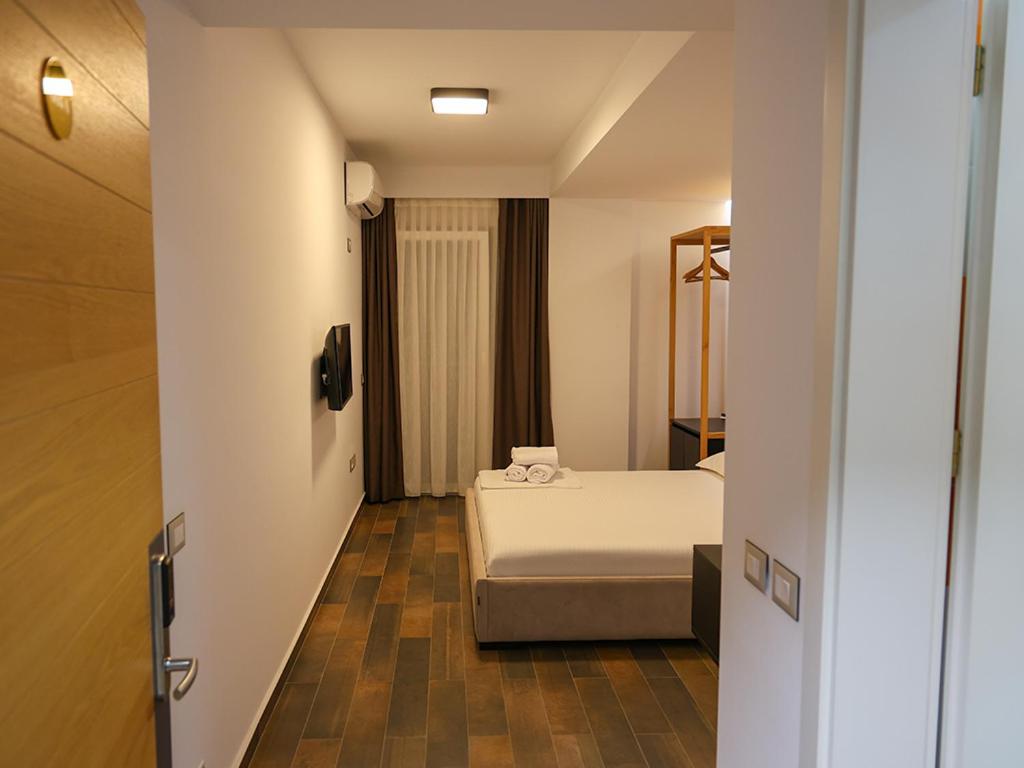 Postel nebo postele na pokoji v ubytování Hotel Adria