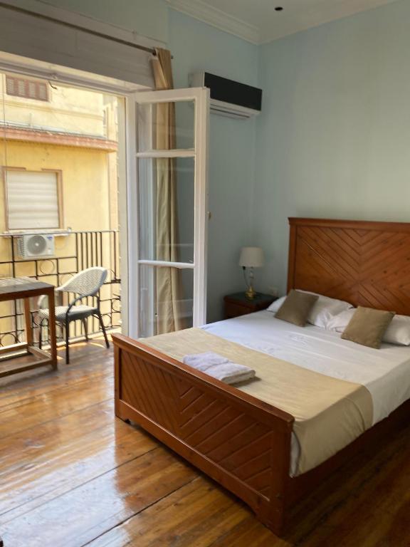 Postel nebo postele na pokoji v ubytování Manzzel Cairo House