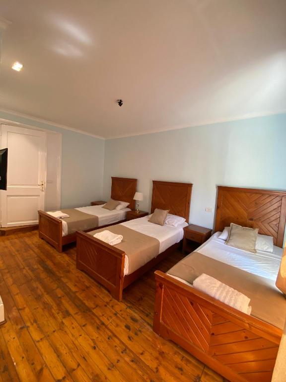 Postel nebo postele na pokoji v ubytování Manzzel Cairo House