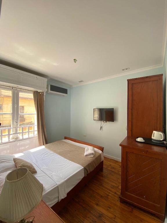 Postel nebo postele na pokoji v ubytování Manzzel Cairo House
