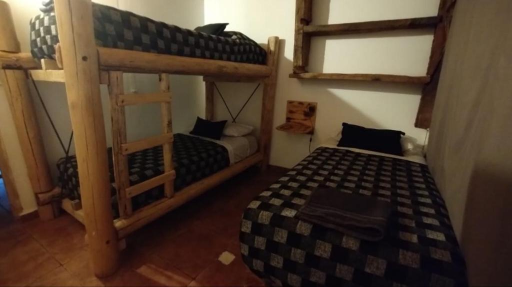 Postel nebo postele na pokoji v ubytování La Posada de Buda