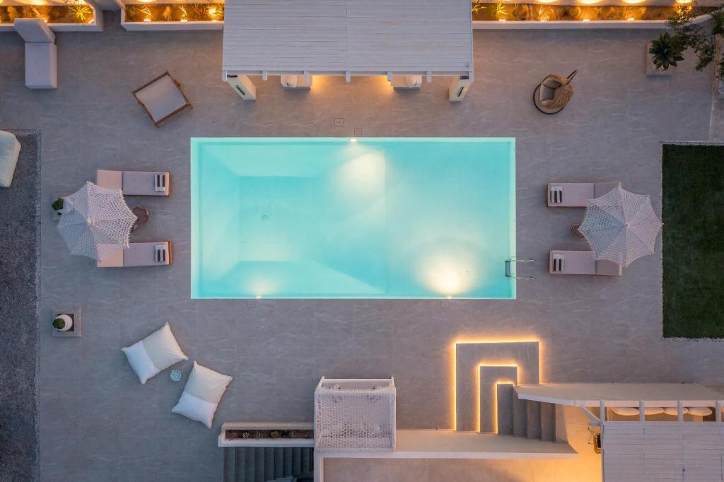an overhead view of a swimming pool on a wall at Villa Eva By Milos Concierge in Adamas