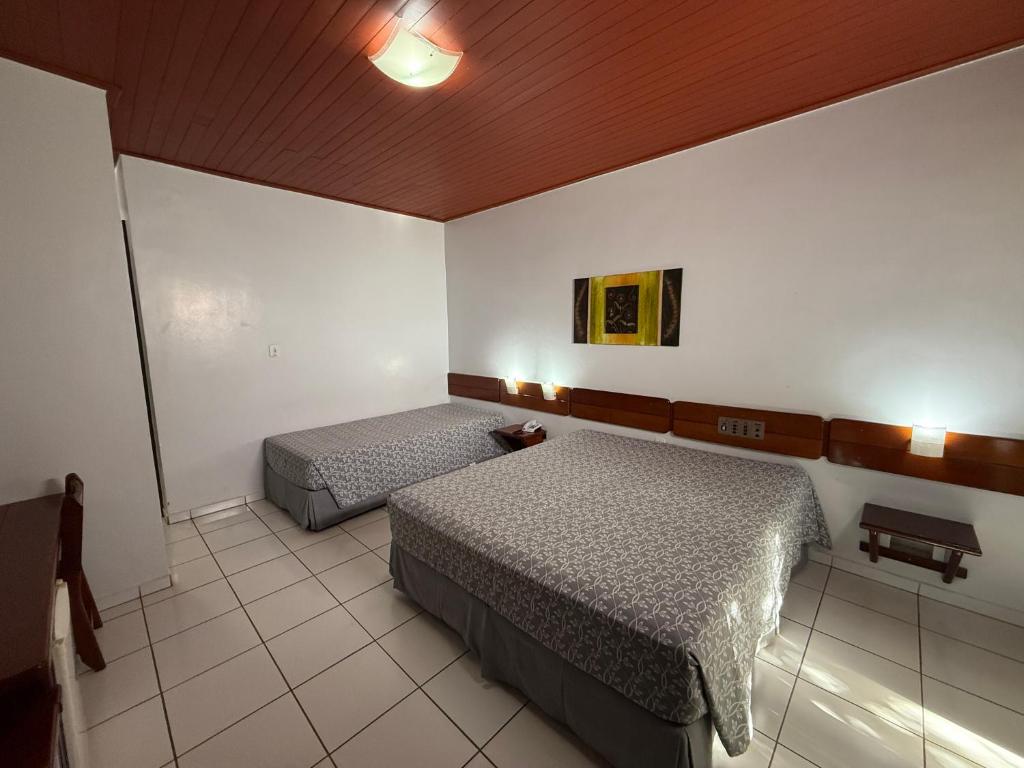 Cama ou camas em um quarto em Thermas diRoma Hotel Incluso o acesso ao Acqua park todos os dias, exceto no dia do check-out