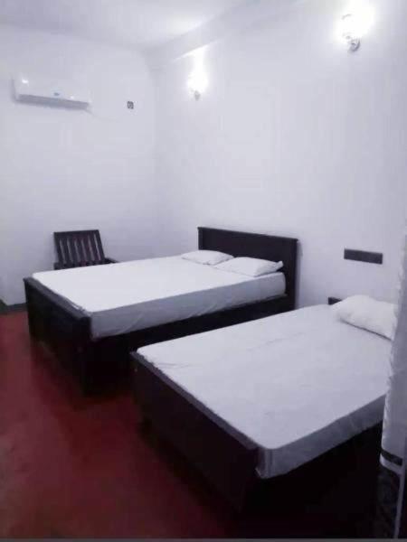 Postel nebo postele na pokoji v ubytování Jasmine Garden & Resort