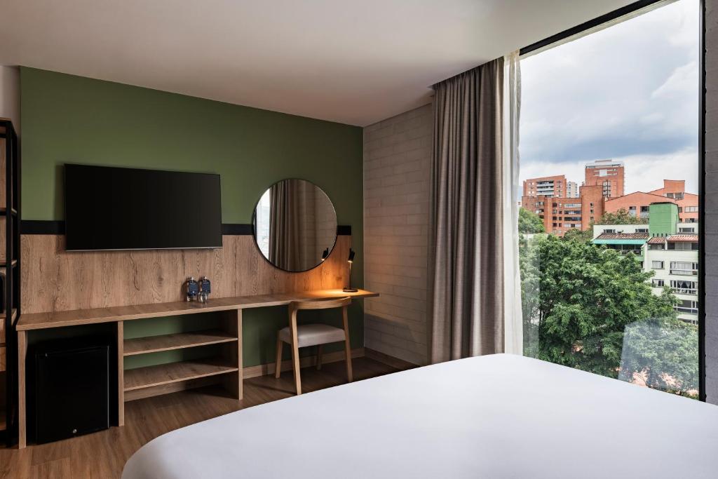 Postel nebo postele na pokoji v ubytování Faranda Collection Medellin, a Member of Radisson Individuals