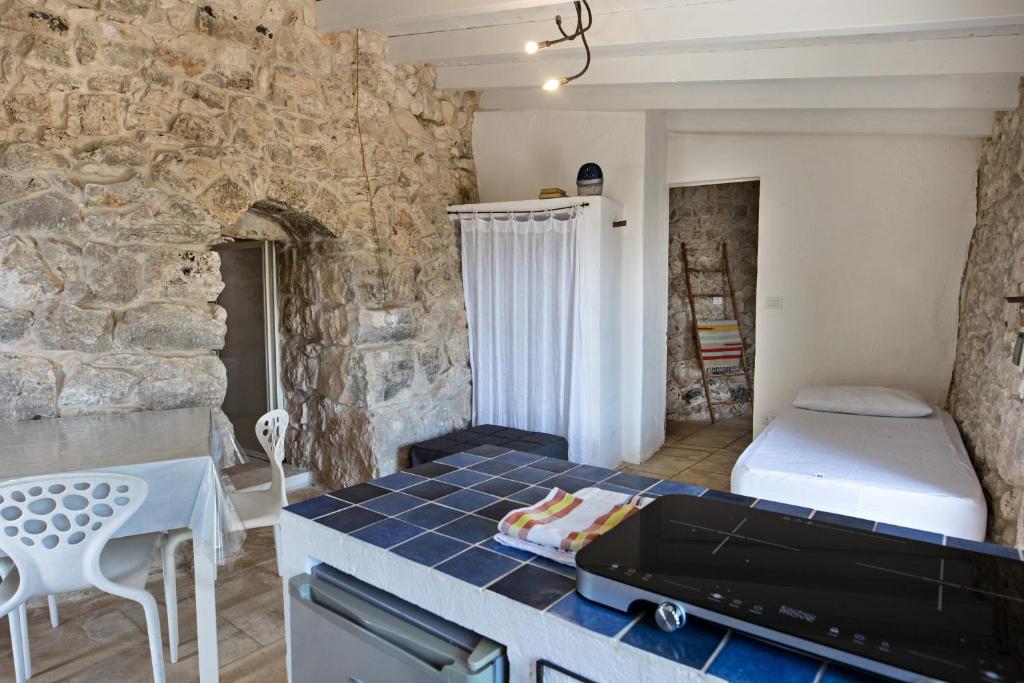 Postel nebo postele na pokoji v ubytování Feudo - Pajara Marancio 1 by Salento Prime