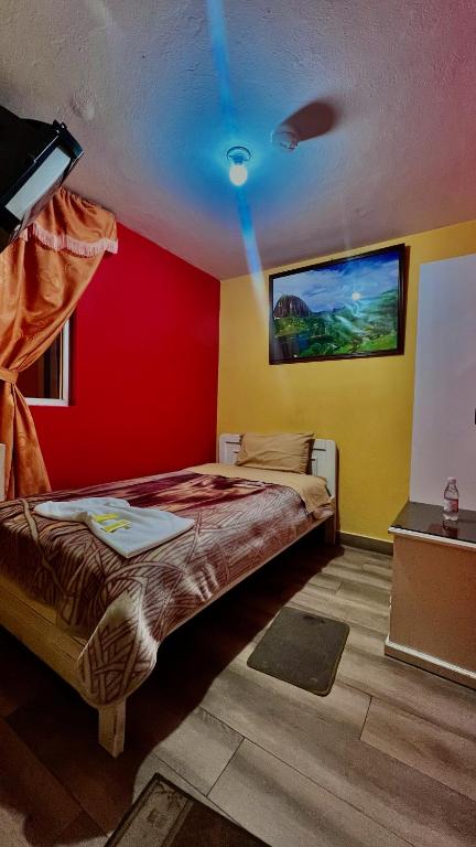 Postel nebo postele na pokoji v ubytování Hotel Jimmy Latacunga