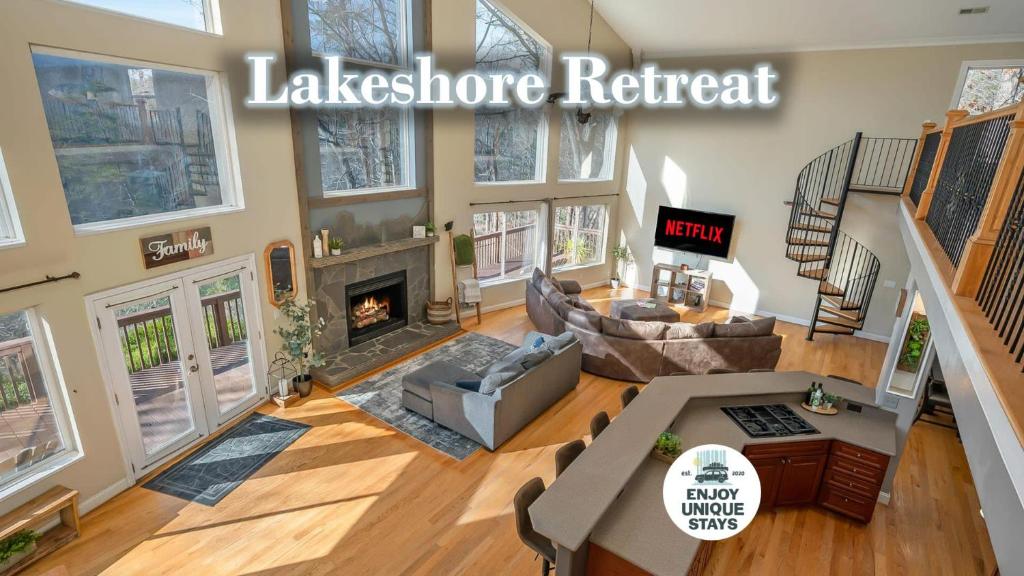 an overhead view of a living room with a fireplace at Lakeshore Retreat with Lake Lanier views & hot tub in Landrum
