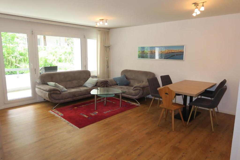 a living room with a couch and a table at Ferienwohnung in den Flumserbergen in Flumserberg