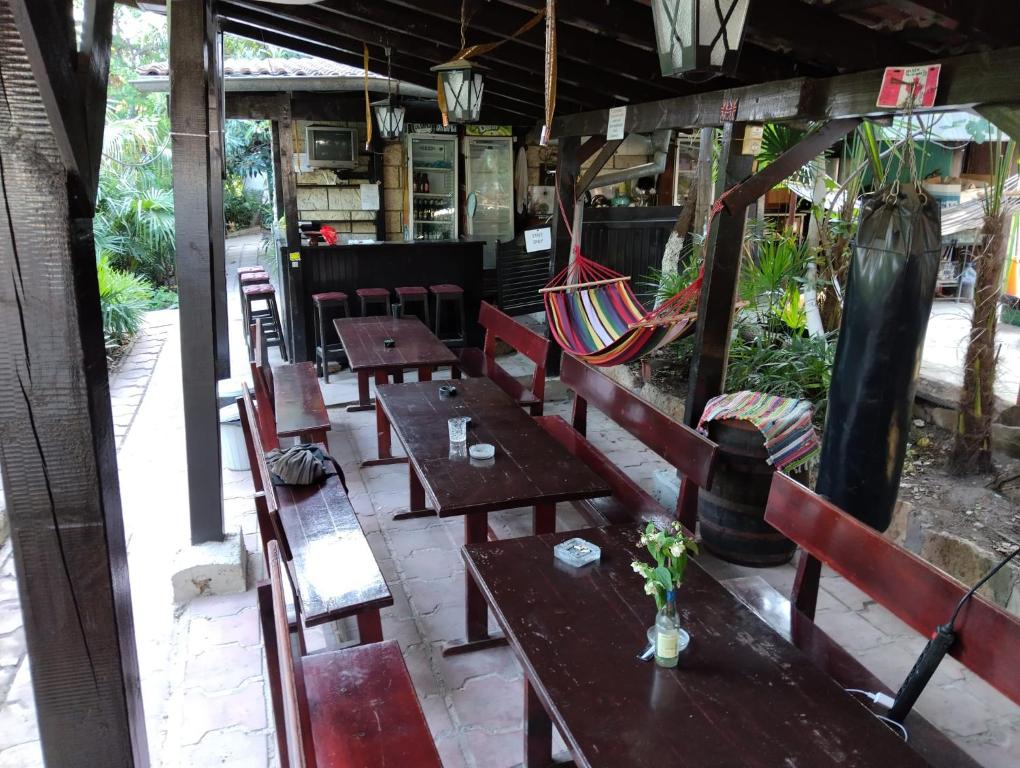 a group of tables and chairs in a restaurant at Hostel Varna Botanika in Varna City