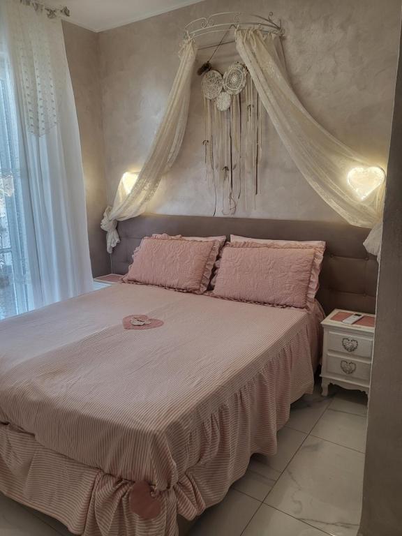 Postel nebo postele na pokoji v ubytování La dimora di Anna