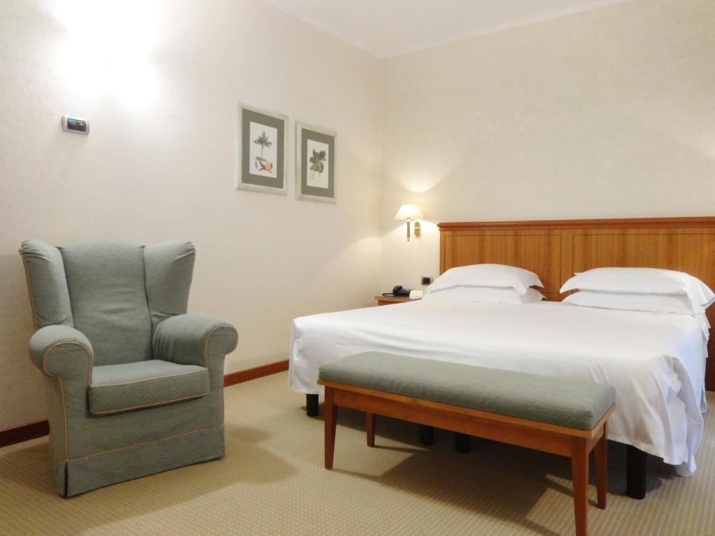 Posteľ alebo postele v izbe v ubytovaní Hotel Excelsior Magenta