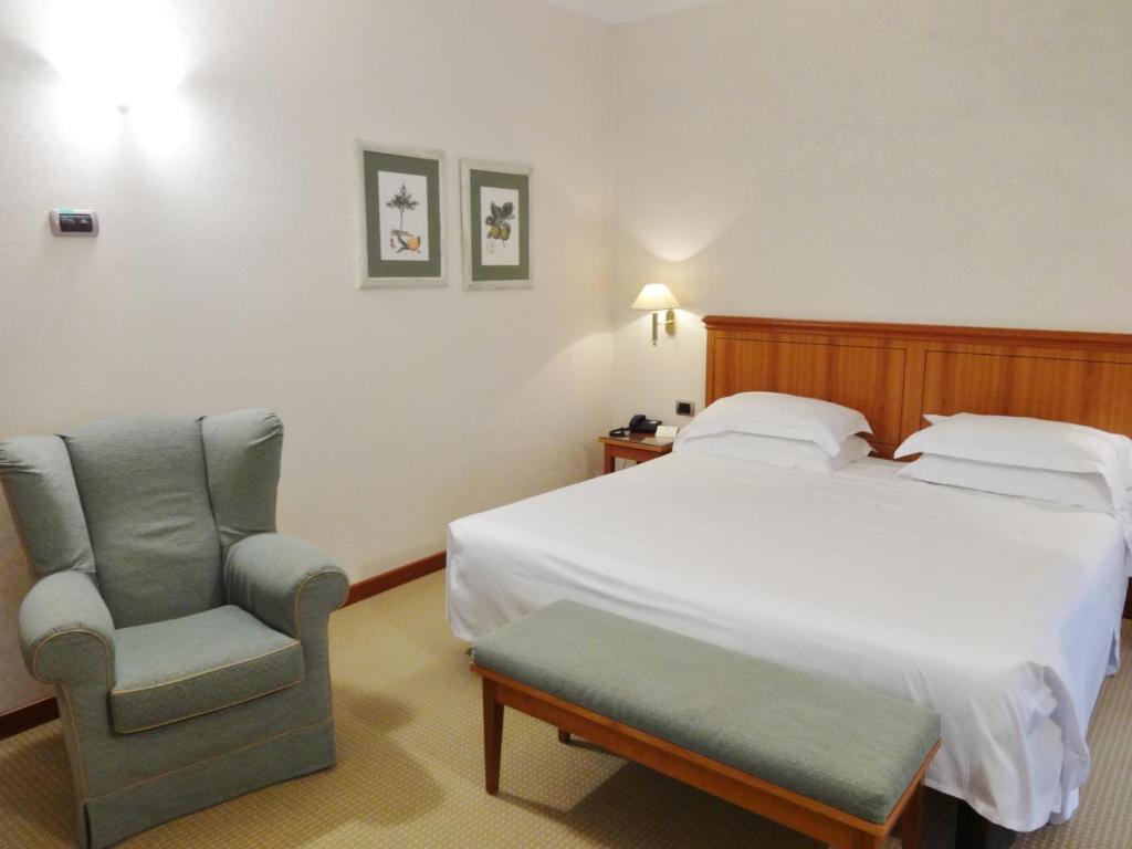 Posteľ alebo postele v izbe v ubytovaní Hotel Excelsior Magenta