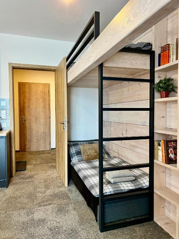 Postel nebo postele na pokoji v ubytování Apartmány na sjezdovce Dolní Morava