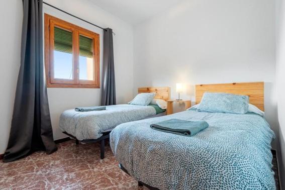 Postel nebo postele na pokoji v ubytování Casa el Ferrer