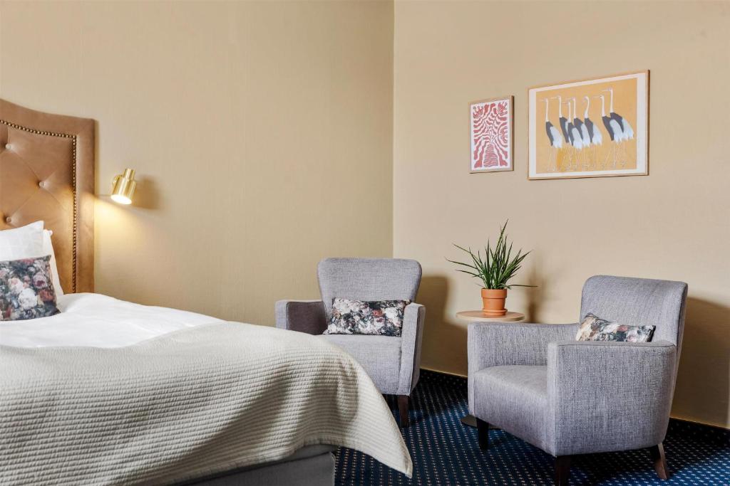 Postel nebo postele na pokoji v ubytování Karlskrona Stadshotell, Best Western Signature Collection