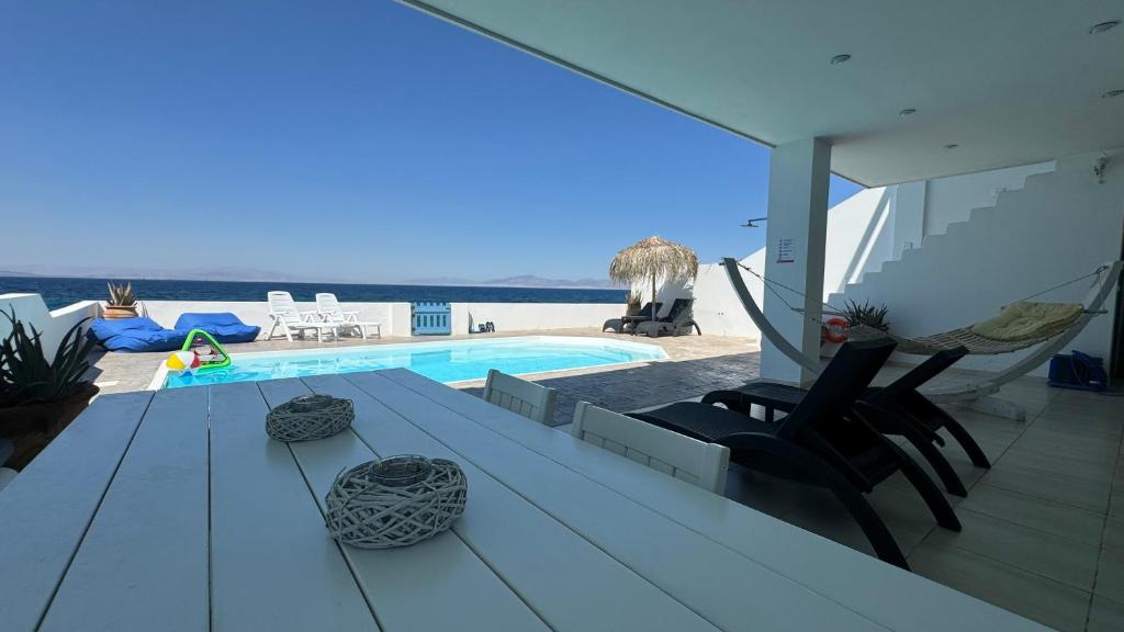 The swimming pool at or close to NV seafront Villa Aegina