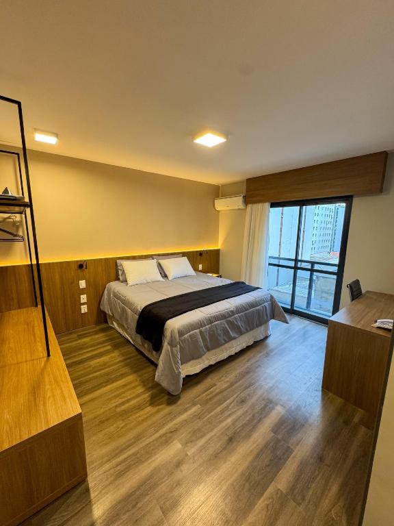 Un pat sau paturi într-o cameră la Flat próximo da Paulista e Oscar Freire