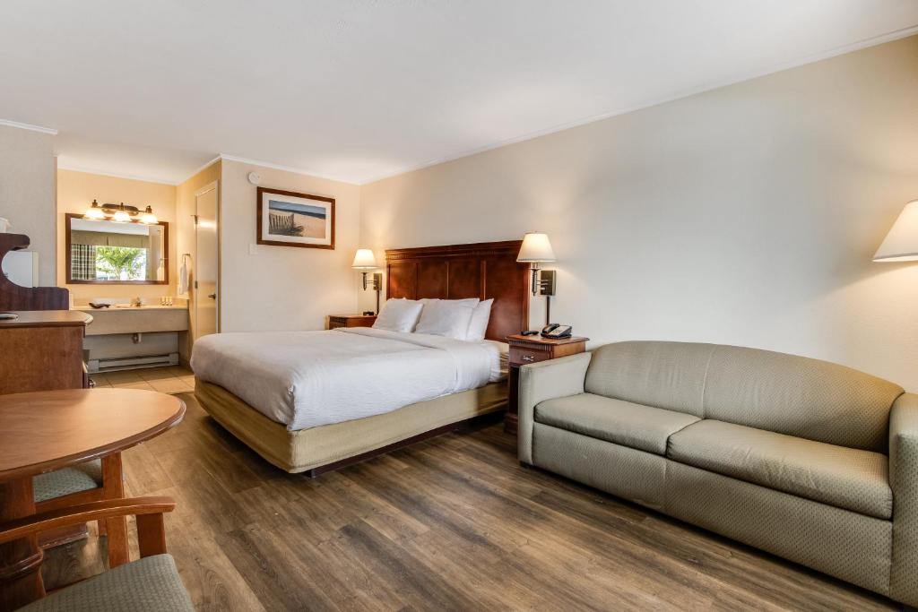 Postel nebo postele na pokoji v ubytování Oceanus Motel - Rehoboth Beach