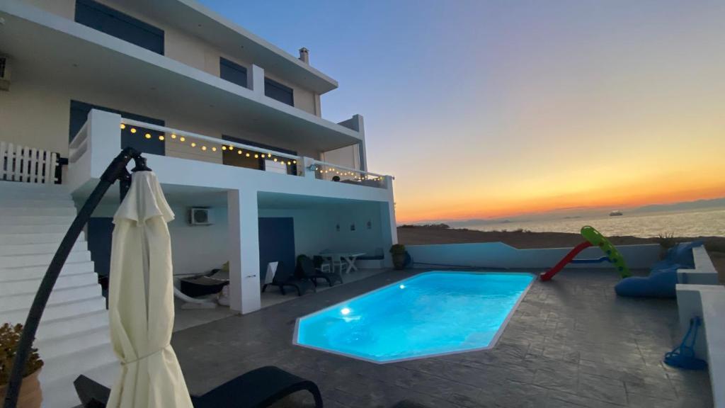 The swimming pool at or close to NV seafront Villa Aegina