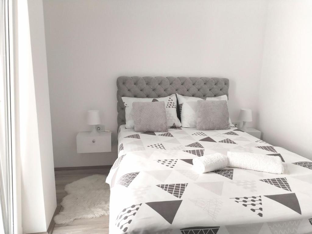 Postel nebo postele na pokoji v ubytování Apartman Simijonovic