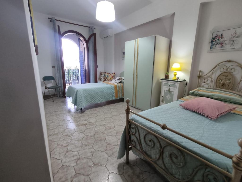 Katil atau katil-katil dalam bilik di La Casa di Nonno Raffaele