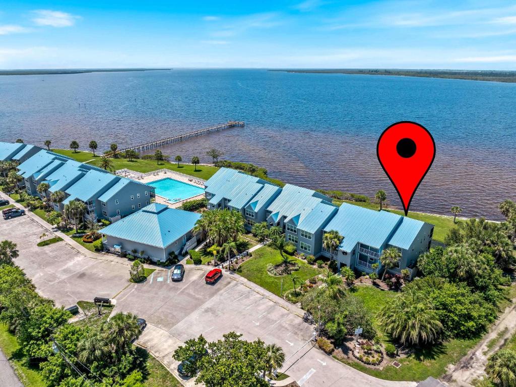 an overhead view of a resort with a red marker at Riverfront Condo w Water Views-Heated Pool in Port Charlotte