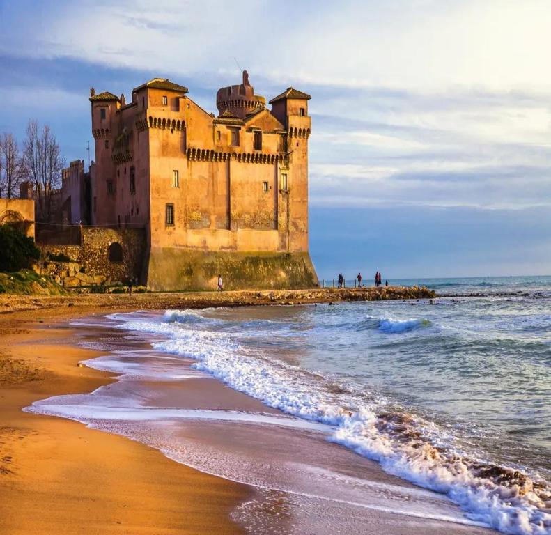 a castle on the shore of a beach at Gigli di Mare - SANTA SEVERA in Santa Severa